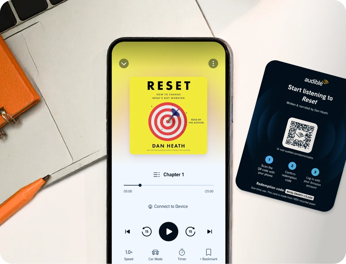 RESET audiobook cover showing in a phone screen with a redemption QR code next to it