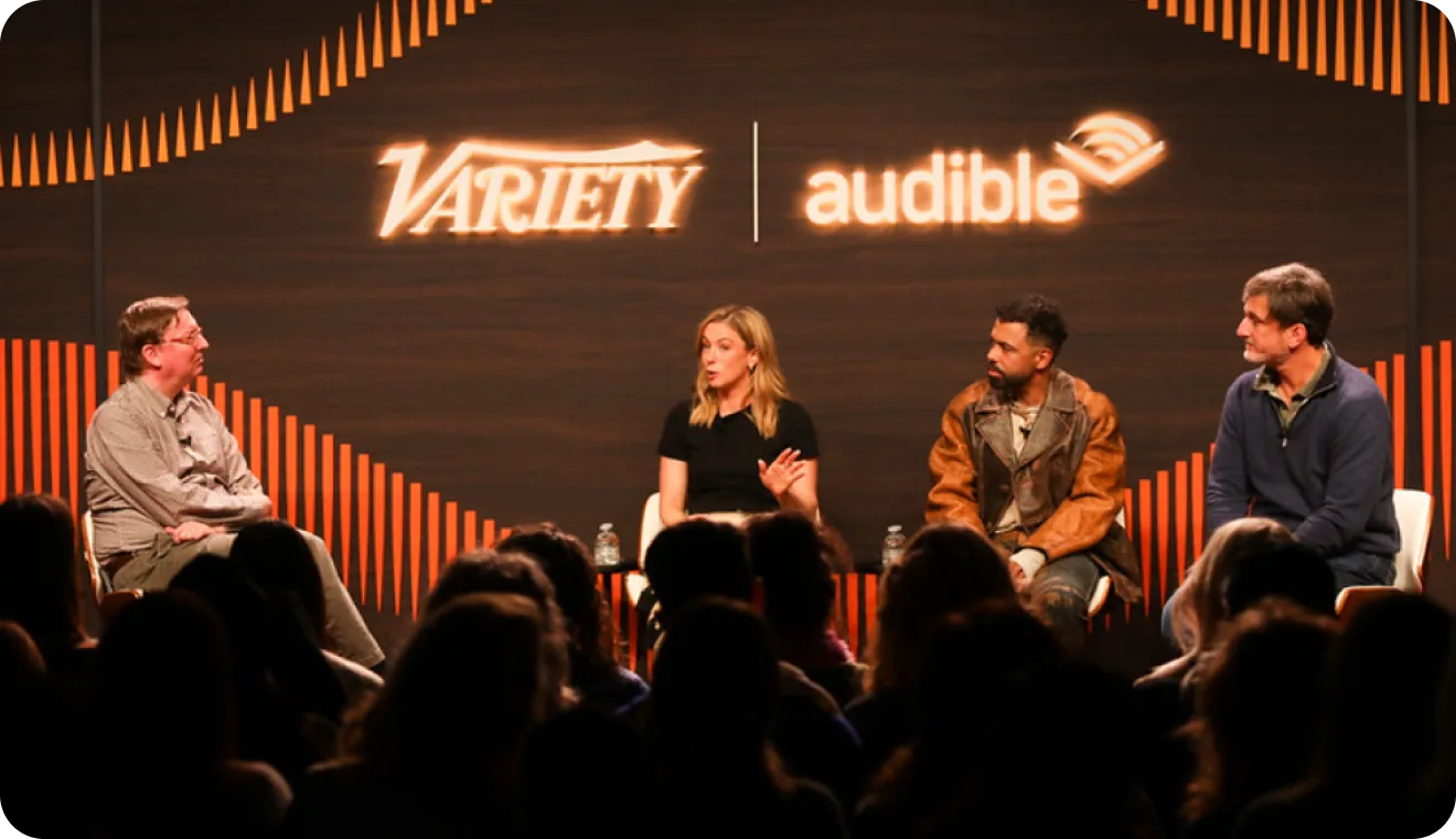 People on stage at an event hosted by Variety and Audible
