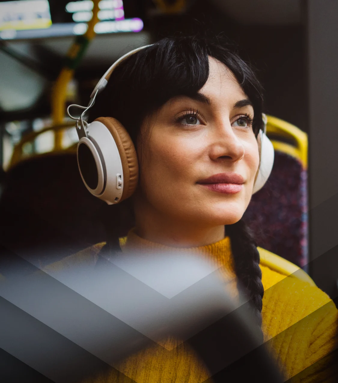 Lady on a bus with headphones on