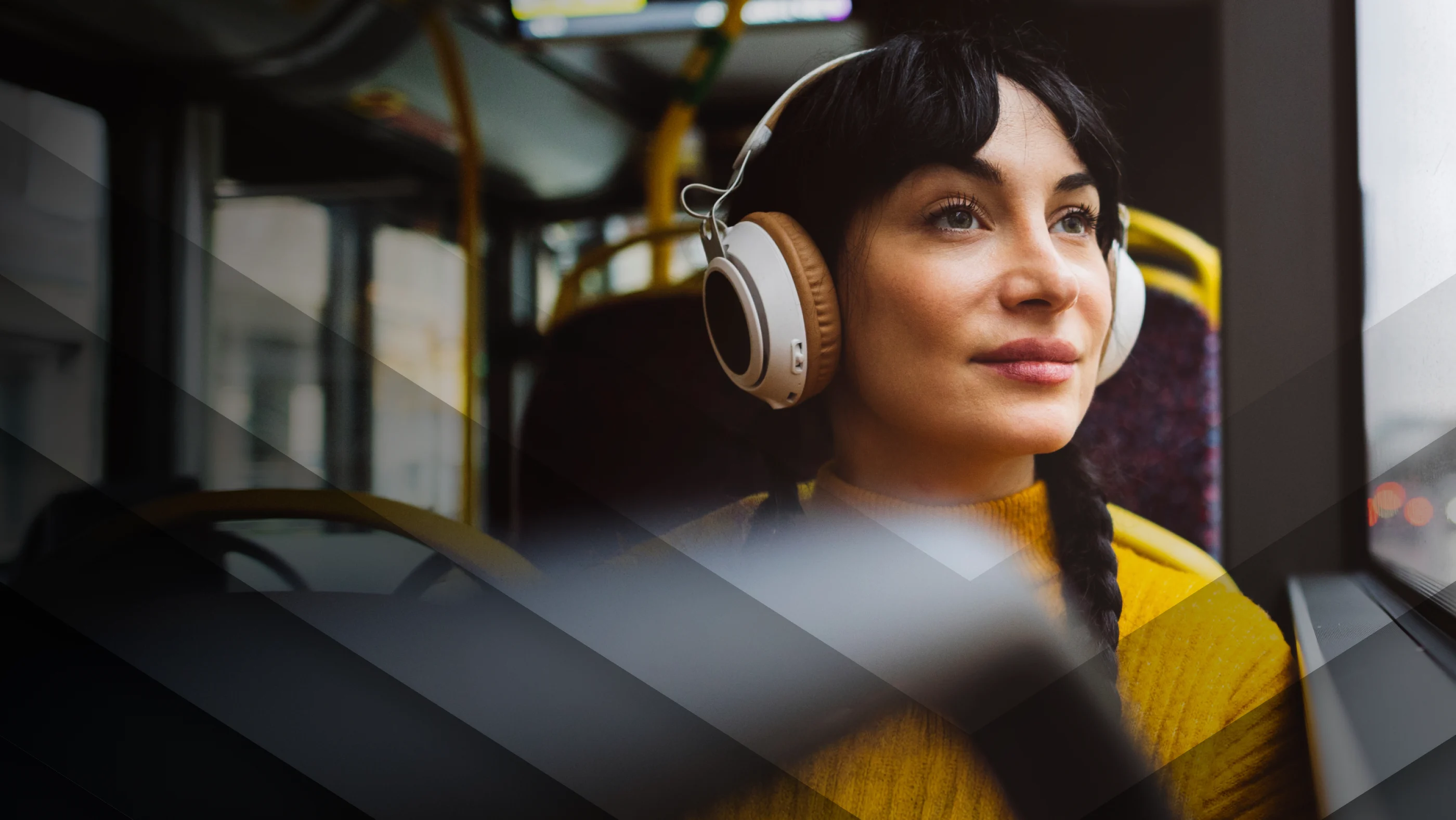 Lady on a bus with headphones on