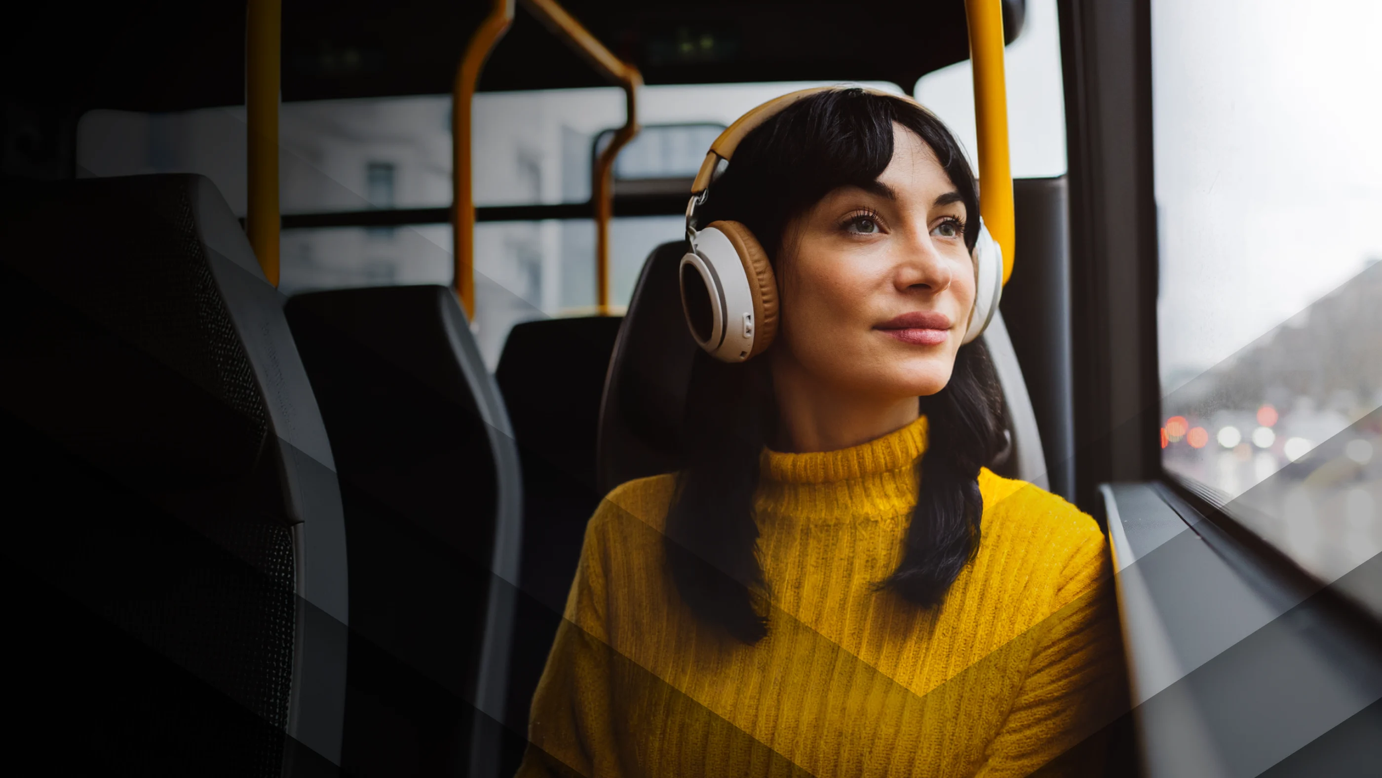 Lady on a bus with headphones on