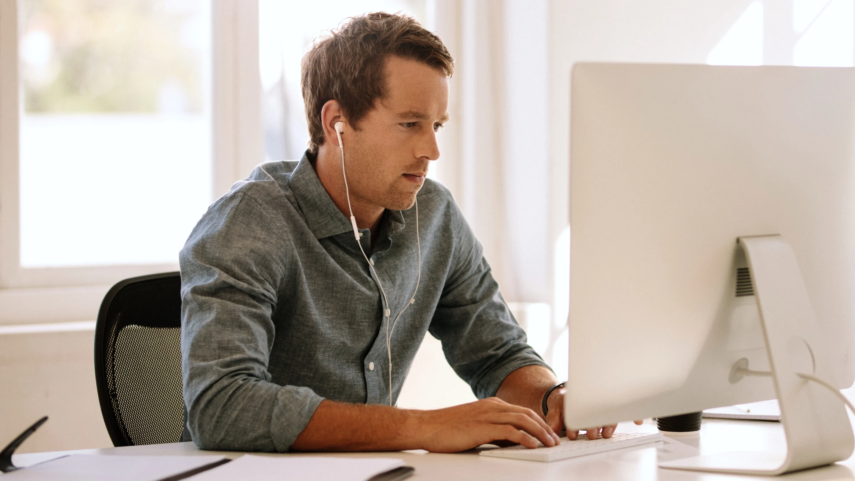 man with headphones working