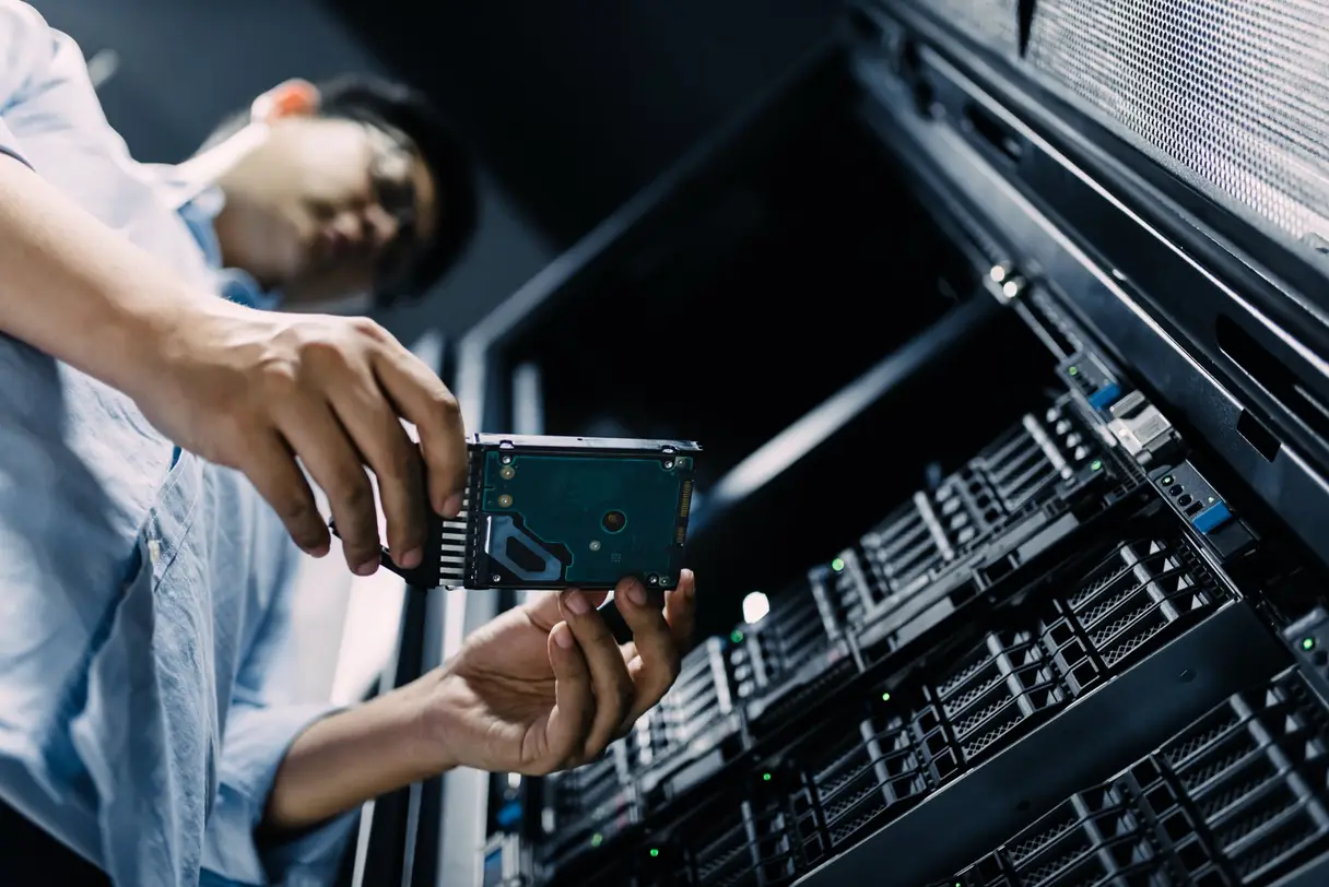 Image of network administrator replacing a hard-drive