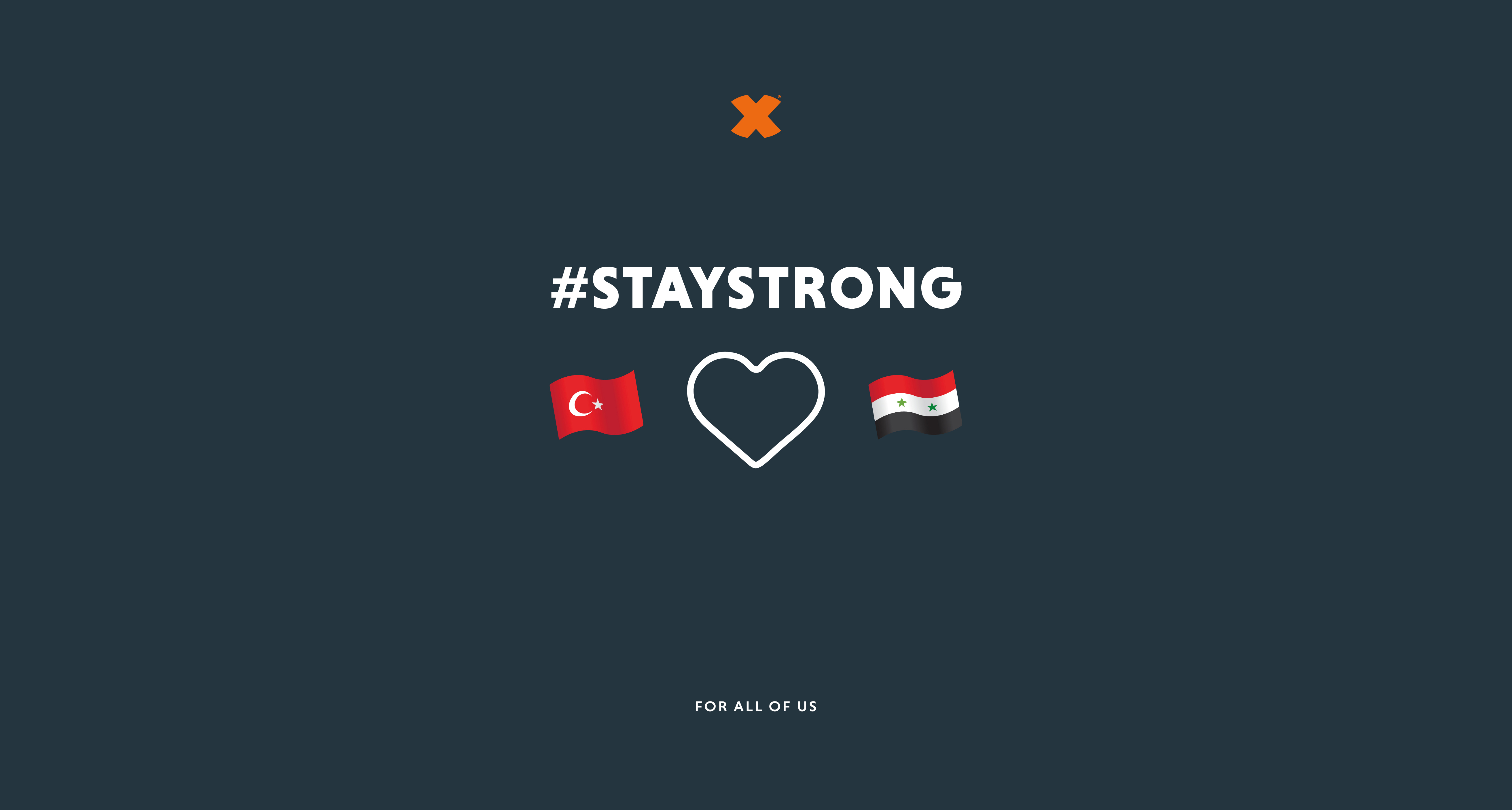 Bild: Bild der türkischen und der syrischen Flagge auf grauen Hintergrund. Zwischen den Flaggen ist ein Herz. Darüber steht der Hashtag 