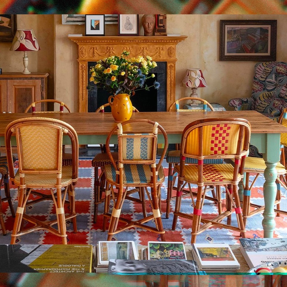 A wooden table with painted sage legs, in Keith McNally's London home