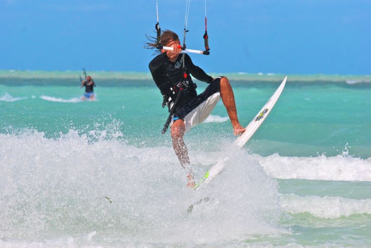 Kiteboarder doing jumps.