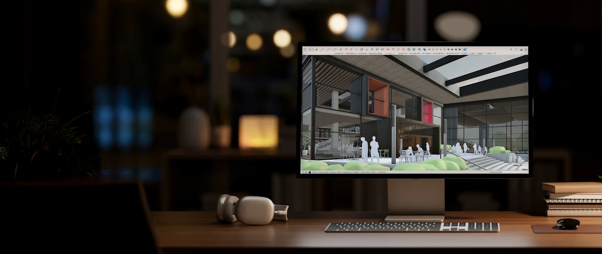 Desktop computer screen with SketchUp open on the monitor displaying a 3D model of a building.