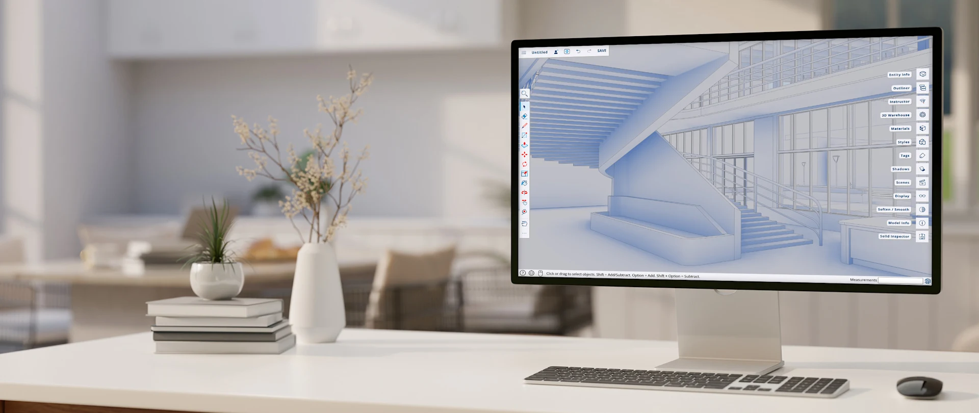 Weißer Schreibtisch mit Computermonitor, Tastatur und Maus. Auf dem Bildschirm wird SketchUp für Desktop mit einem geöffneten Modell angezeigt.