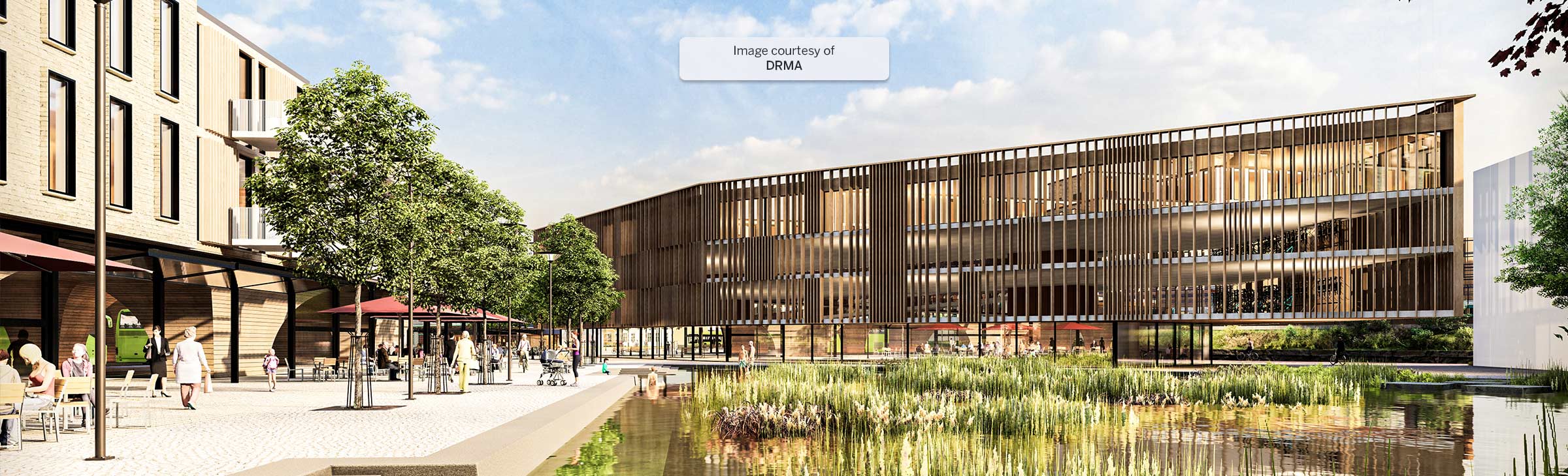 Exterior render created in SketchUp of a large four-story commercial building with many windows and a pond with foliage in the foreground.