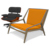A 3D model rendering of an Eames Lounge Chair and an orange chair, sourced from Trimble’s SketchUp 3D Warehouse.