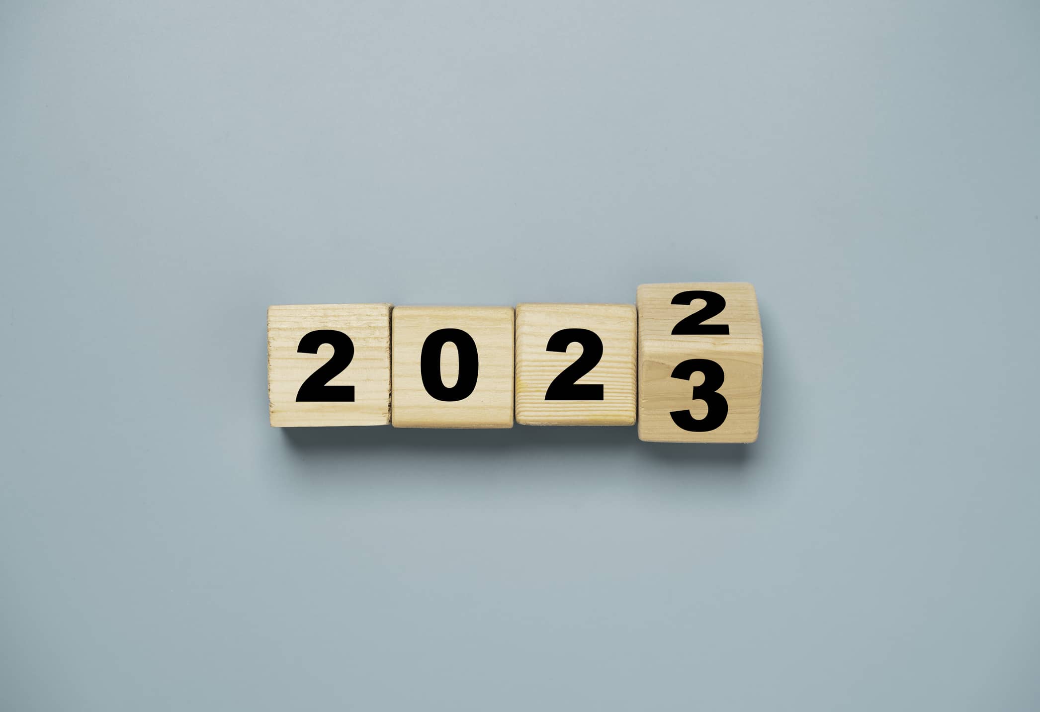 Wooden blocks illustrating the transition from 2022 to 2023