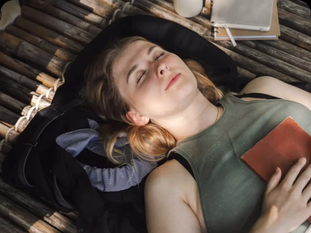 A patient resting, phone in hand, after finding care through a Reliqio-built platform