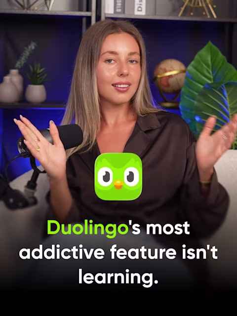 Valeria from Reliqio at a podcast microphone beside the Duolingo owl, with the title "Duolingo's most addictive feature isn't learning."