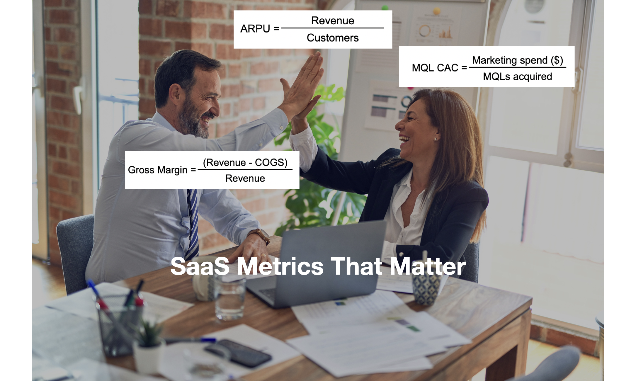 high fiving saas metrics in an office