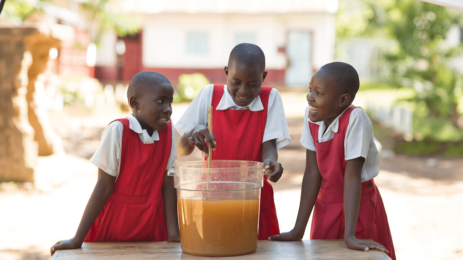 CSDW program three students watches water purification process which is using revolutionary P&G purifier of water technology