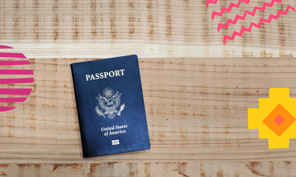 an american passport on a wooden table 