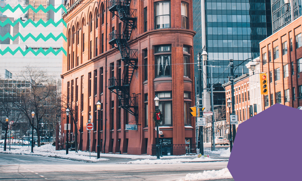 A street in Toronto during winter with buildings in the background “A