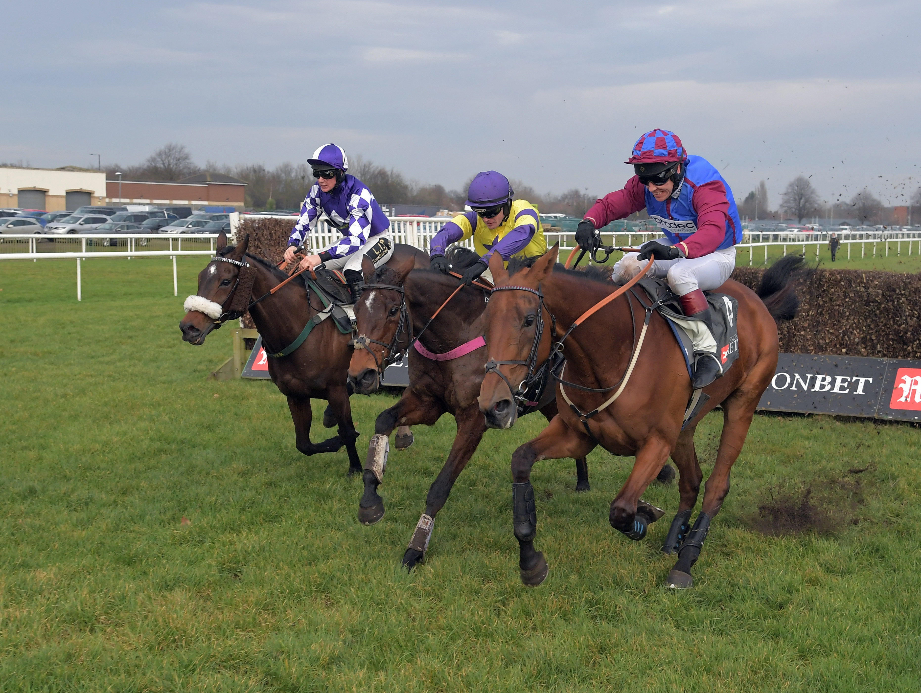  Lady Buttons, left, Happy Diva, centre, and La Bague Au Roi are locked together after the last at Doncaster (Focusonracing)