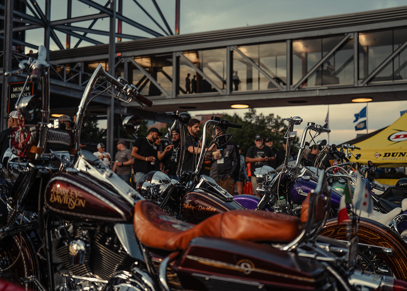 Custom motorcycles and crowd at H-D museum