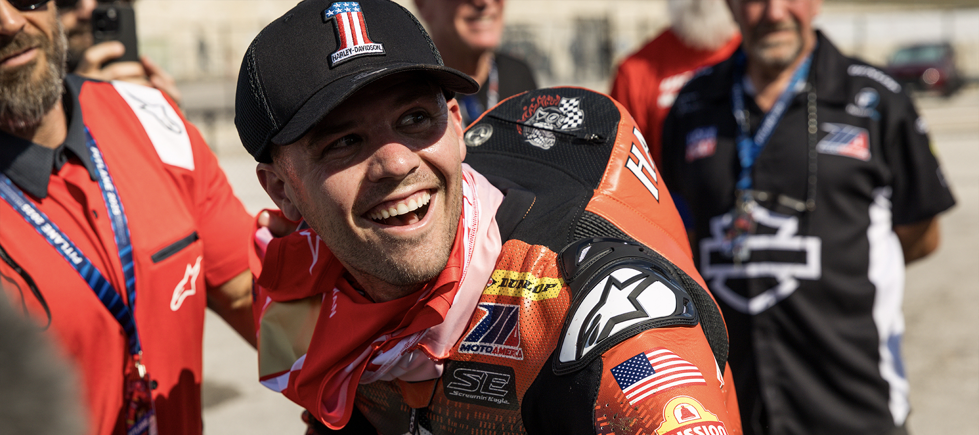 A close up portrait of Kyle Wyman smiling after his King Of The Baggers winning race.