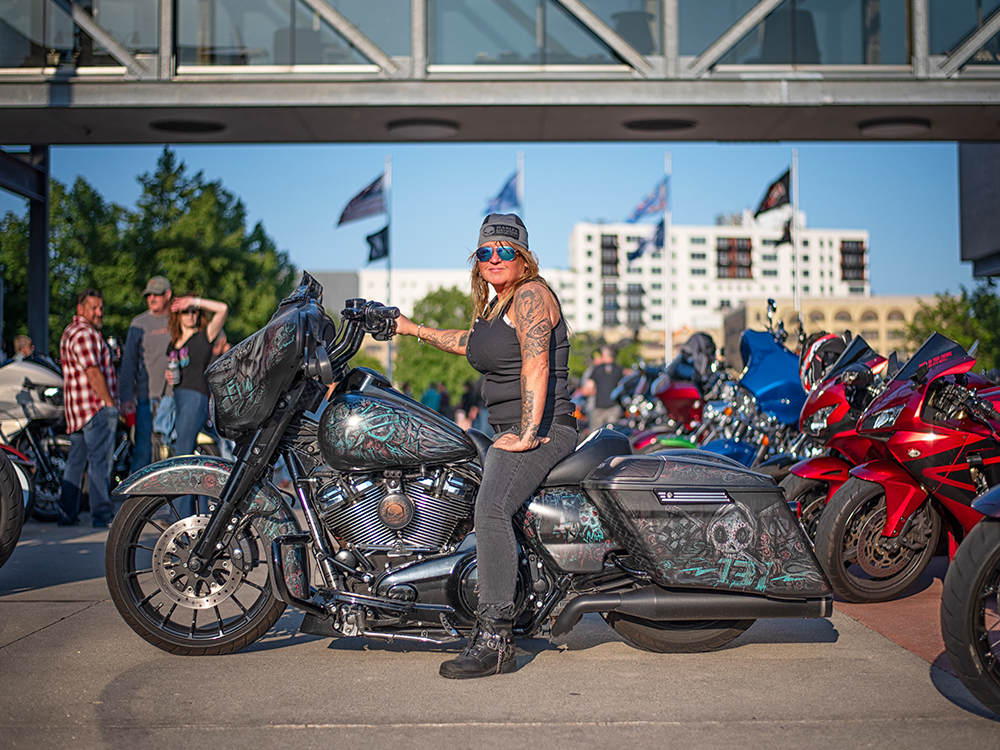 Woman sitting on an Harley