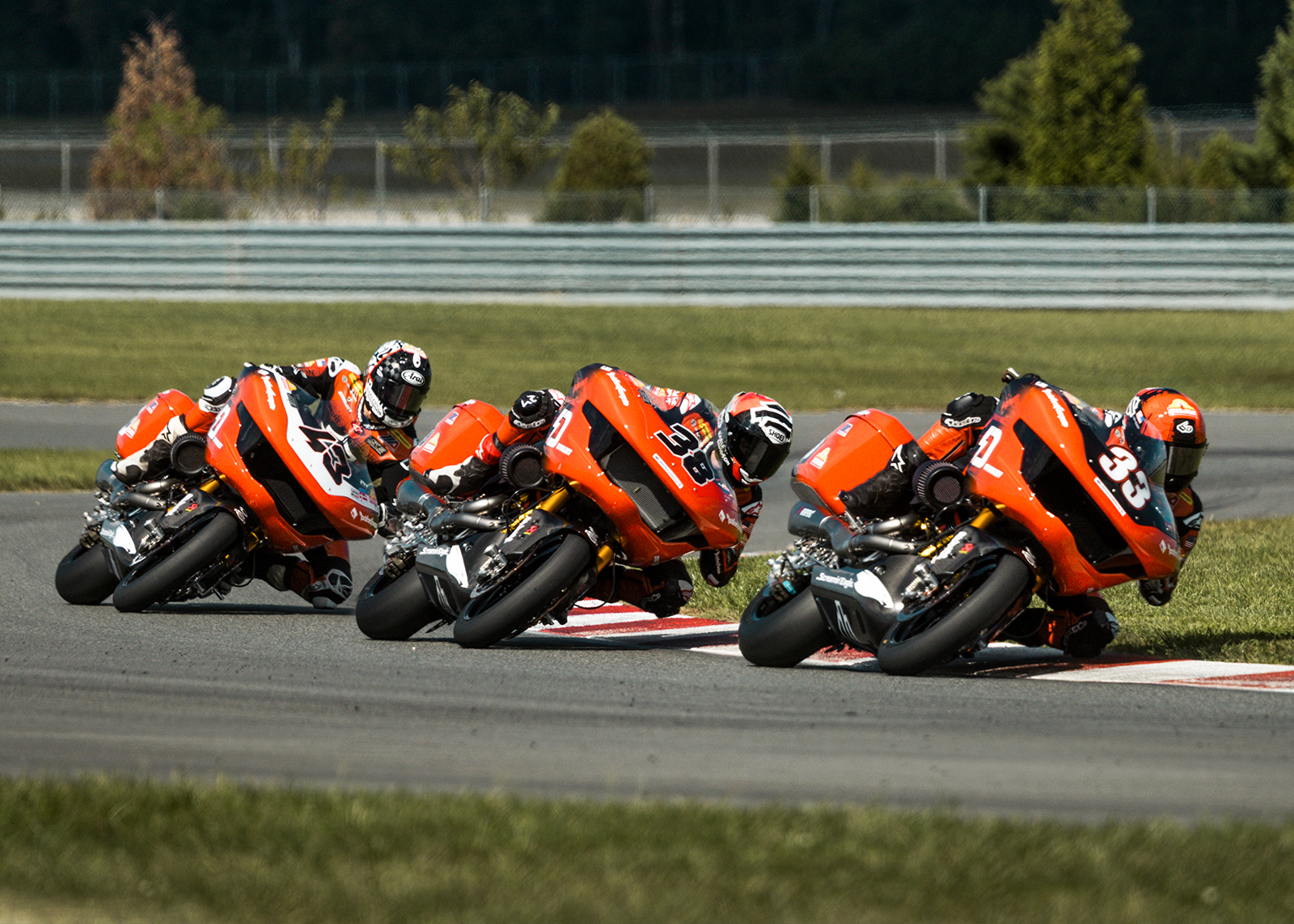 Kyle Wyman, Bradley Smith, and James Rispoli all lean through a corner one right after another during a King of the Baggers race.
