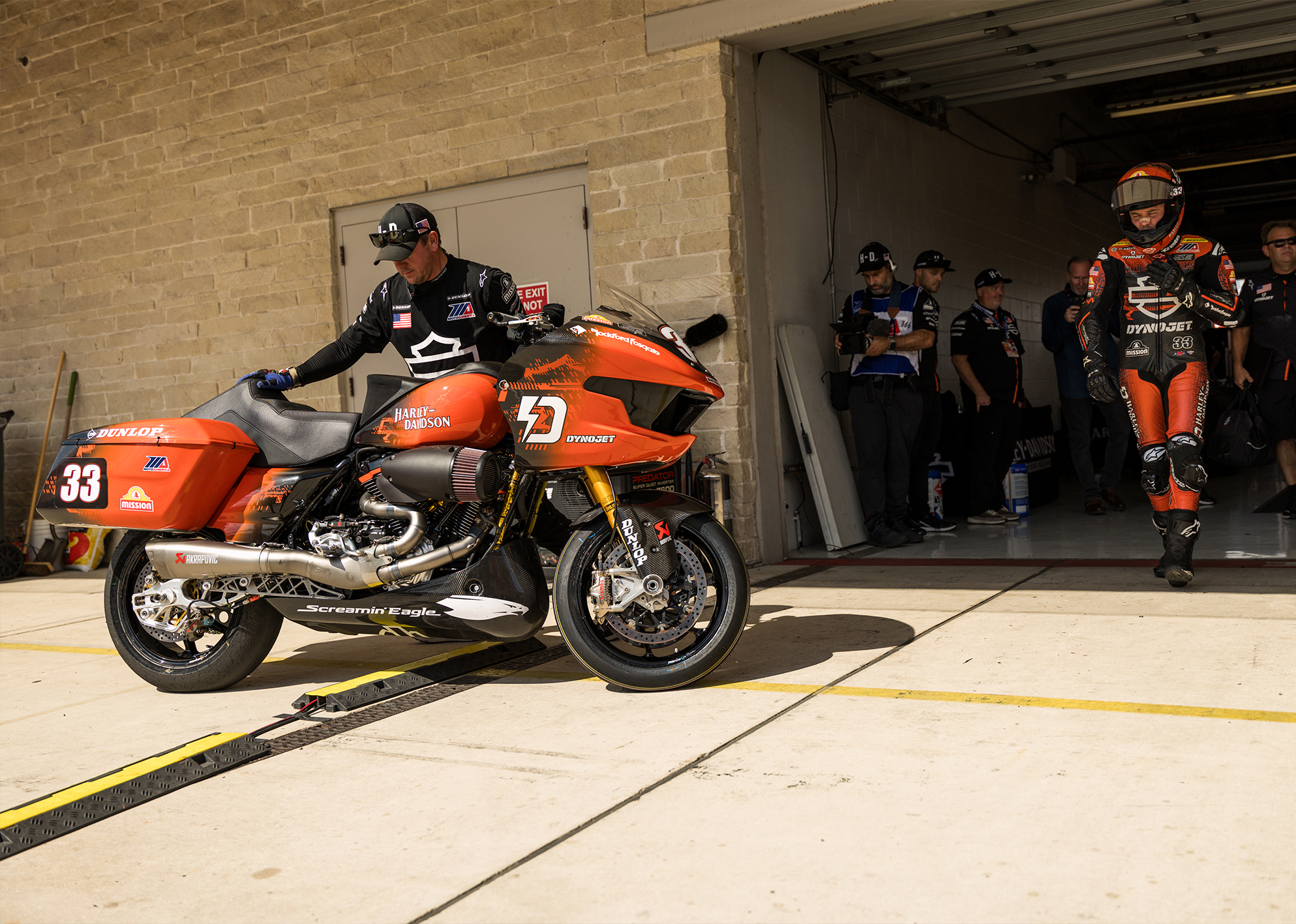  Kyle Wyman walks out of the garage towards his race motorcycle at Circuit of the Americas.