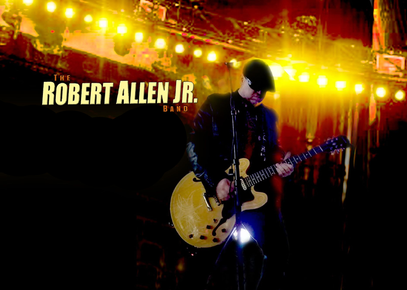 Guitarist playing on stage under bright yellow lights with band behind