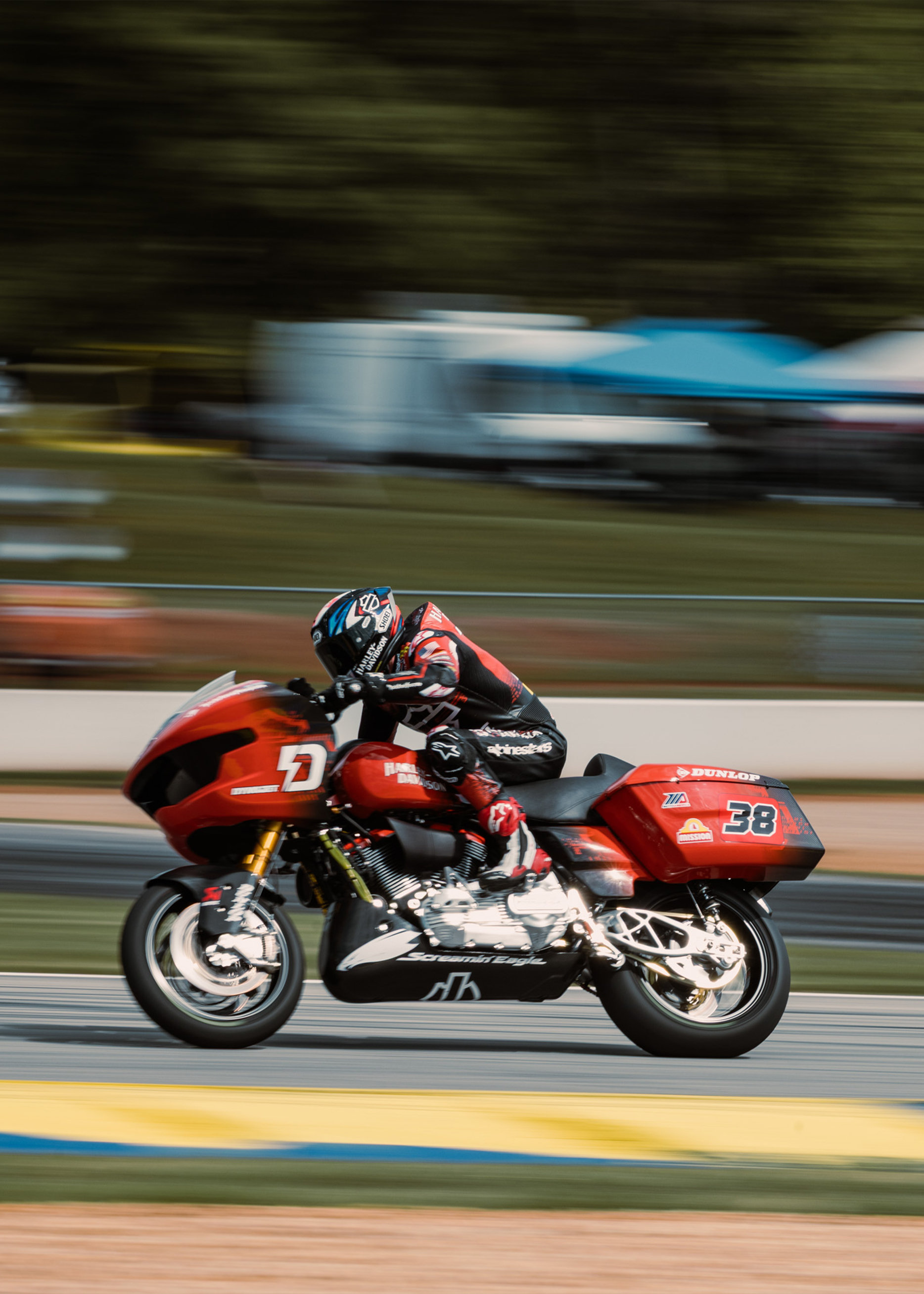 H-D Rider Bradley Smith speeds by the camera on his number 38 Road Glide.