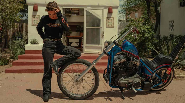 woman wearing a shirt next to a bike