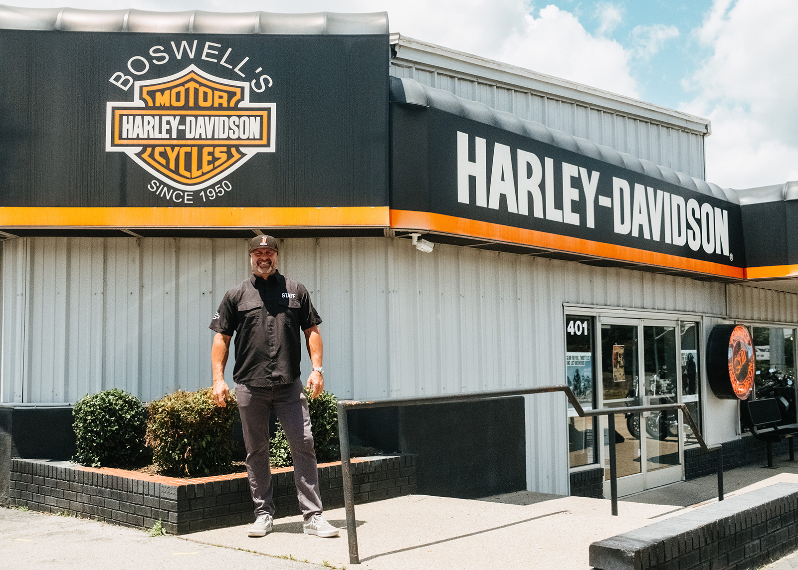 General Manager Craig Collins of Boswell’s Harley-Davidson stands in front of the dealership.