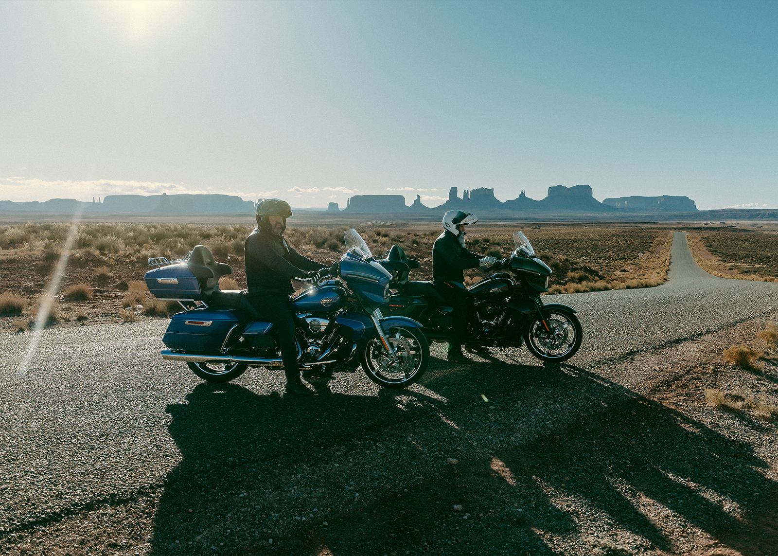 Two men on their bikes on the side of the road