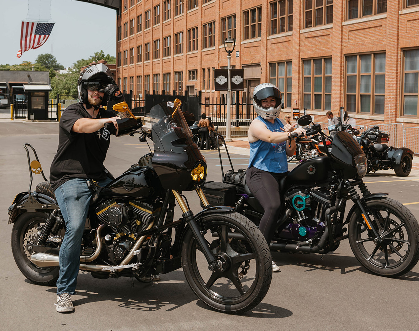 2 riders in front of H-D juneau headquarters