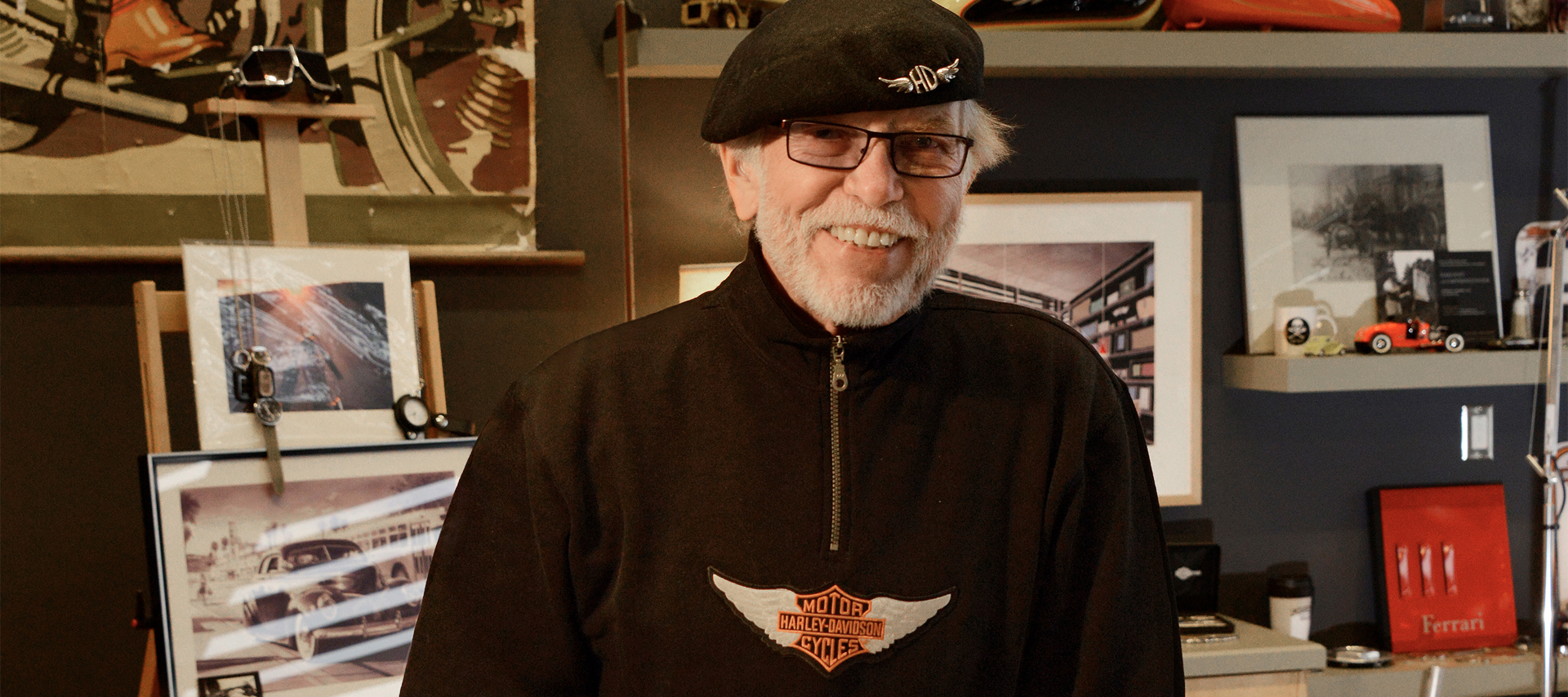 Willie G Davidson smiles in his office 