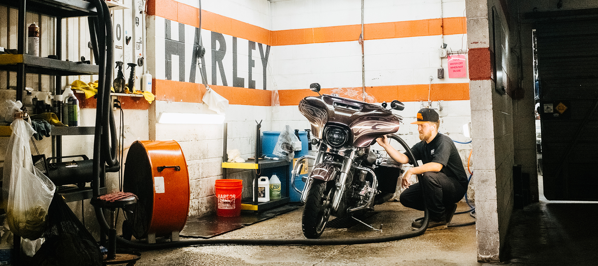 Boswell’s Harley-Davidson staff working on a customer’s motorcycle in the service department.