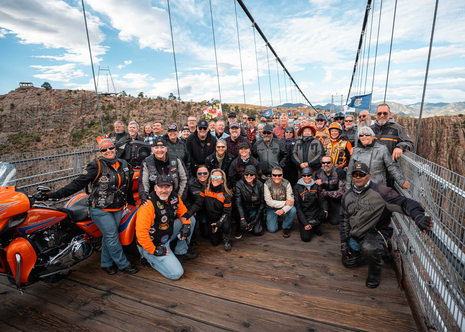 A large group of H.O.G. members pose for a photo on the Royal Gorge suspension bridge.