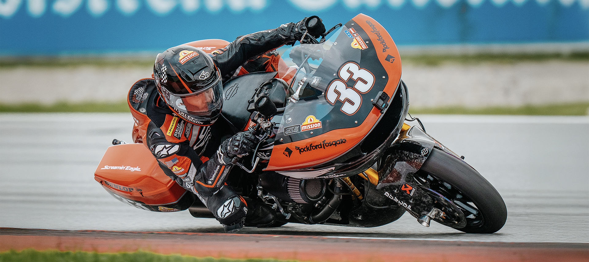 Kyle Wyman leans his number 33 Harley-Davidson Road Glide into a corner on a racetrack