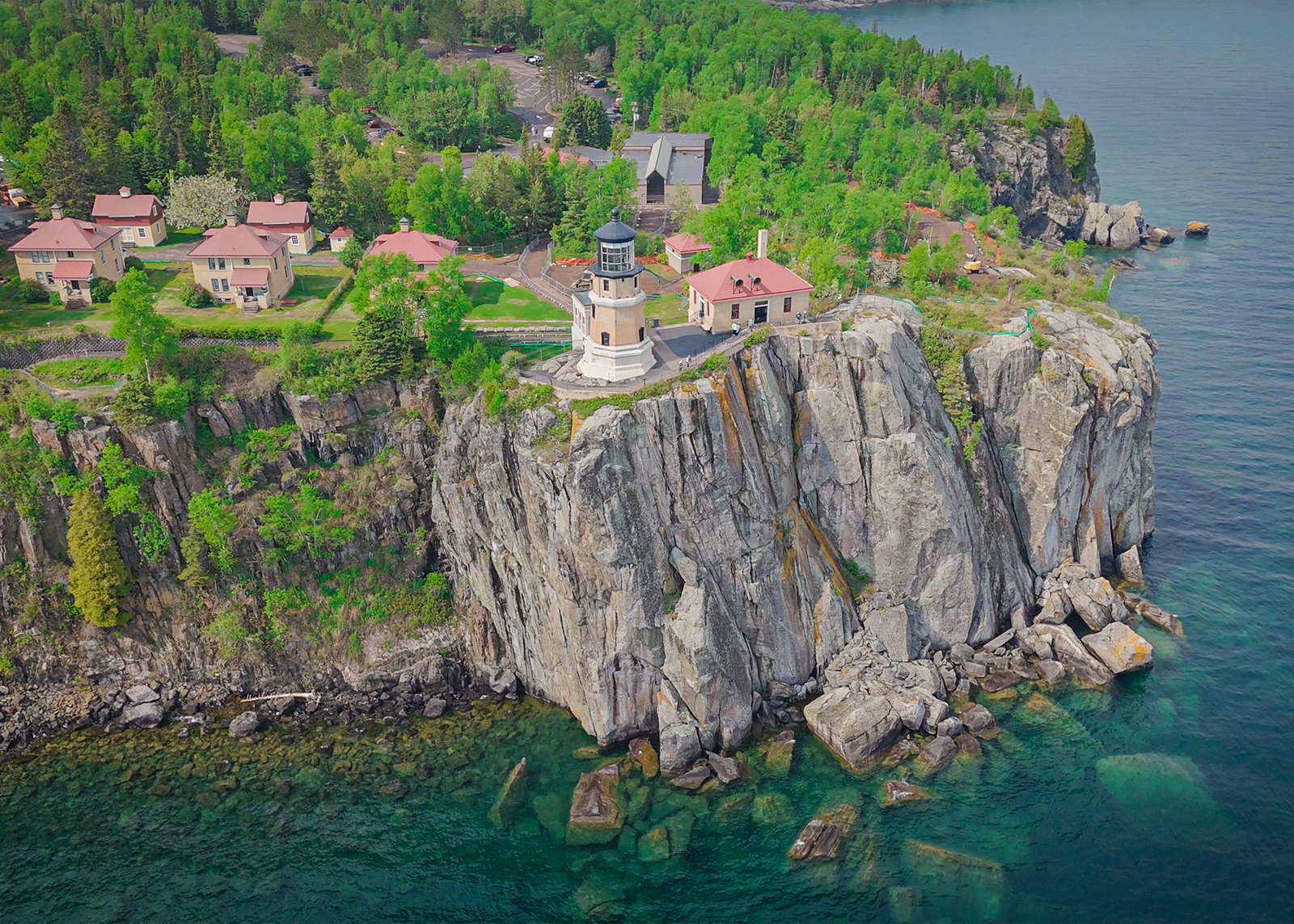 Scenic aerial view of Split Rock Lighthouse perched on a rocky cliff above Lake Superior’s shoreline.