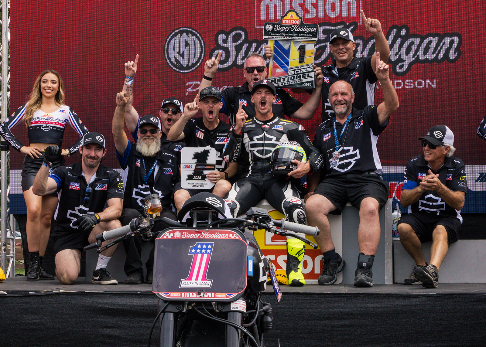 James Rispoli celebrates with his Harley-Davidson team on the podium.