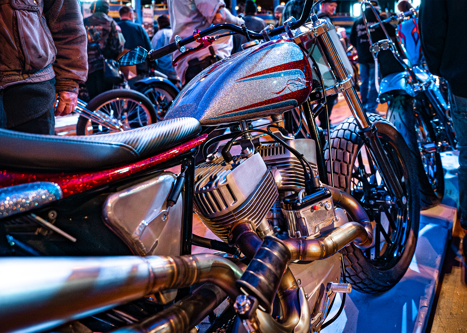 A customized flathead motorcycle on the showroom floor