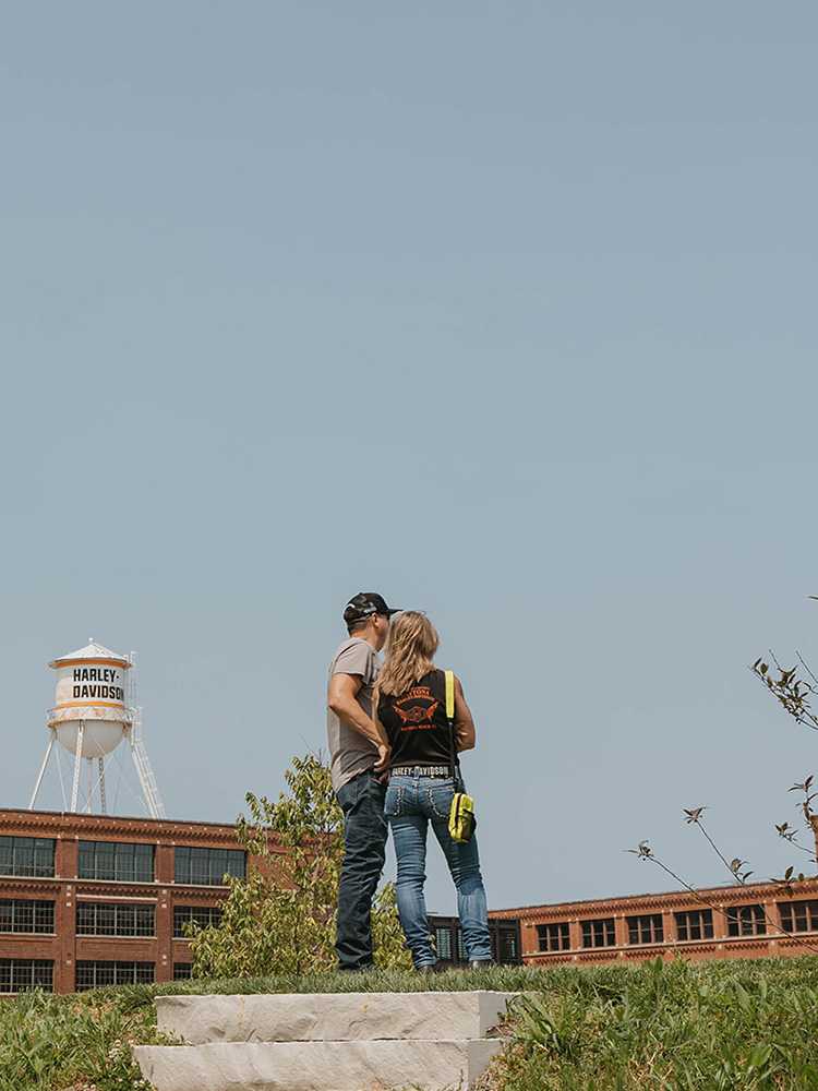 couple standing in front of H-D juneau headquarters
