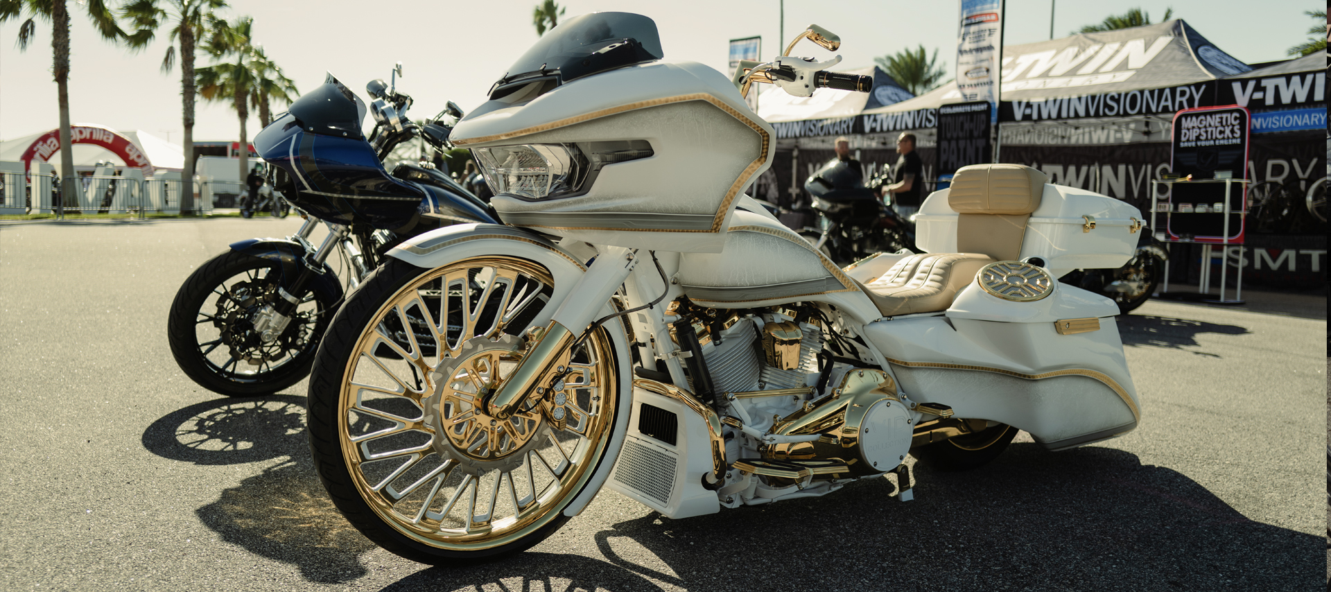 A white fully customized Road Glide is parked in a show 