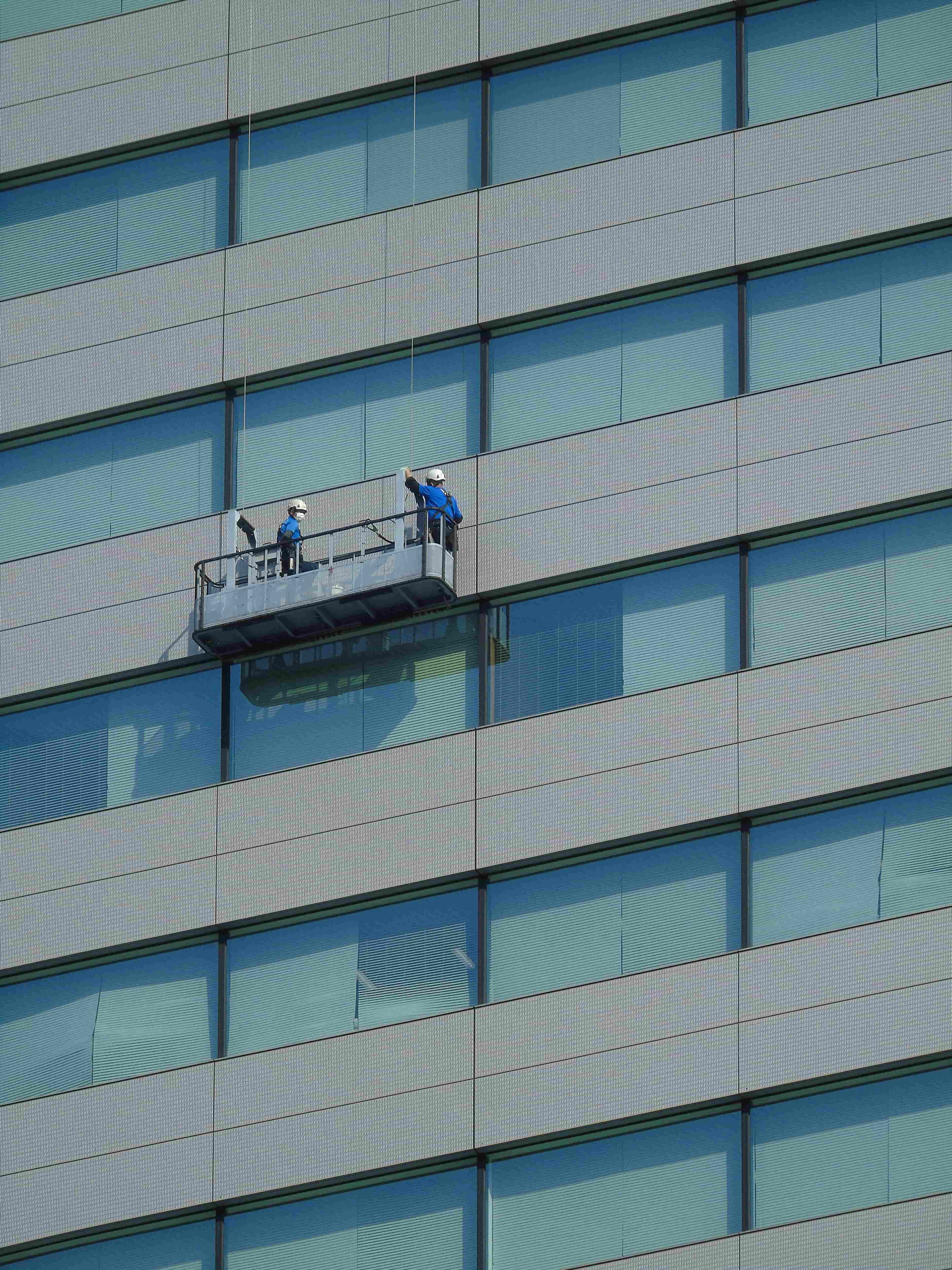 What does facade cleaning involve on a commercial building?