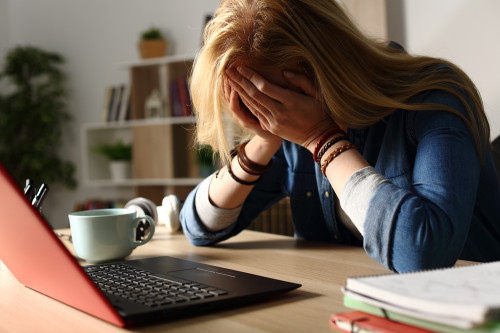 Nervous Woman on Laptop