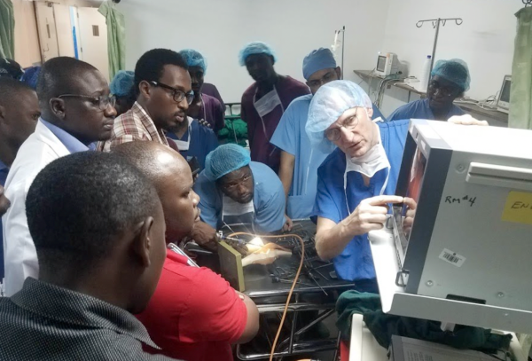 Doctor showing imaging on a medical machine