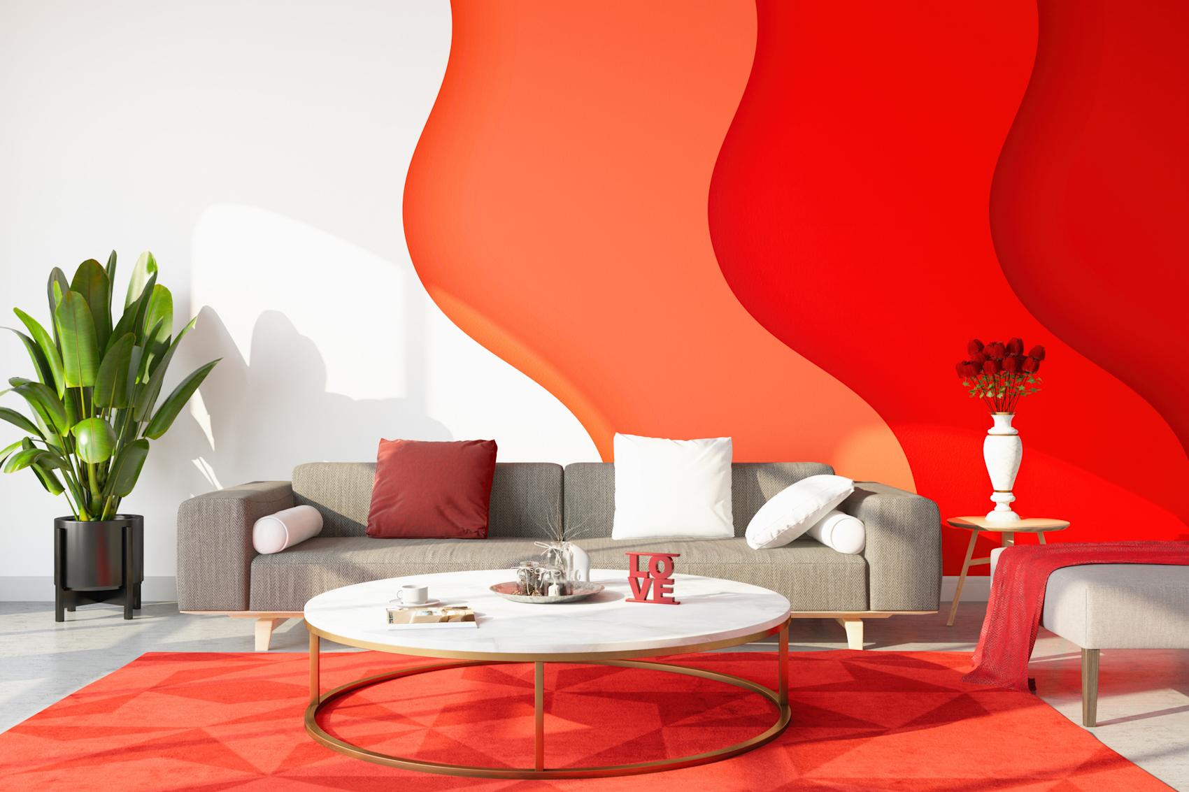 Modern vardagsrum med röda detaljer