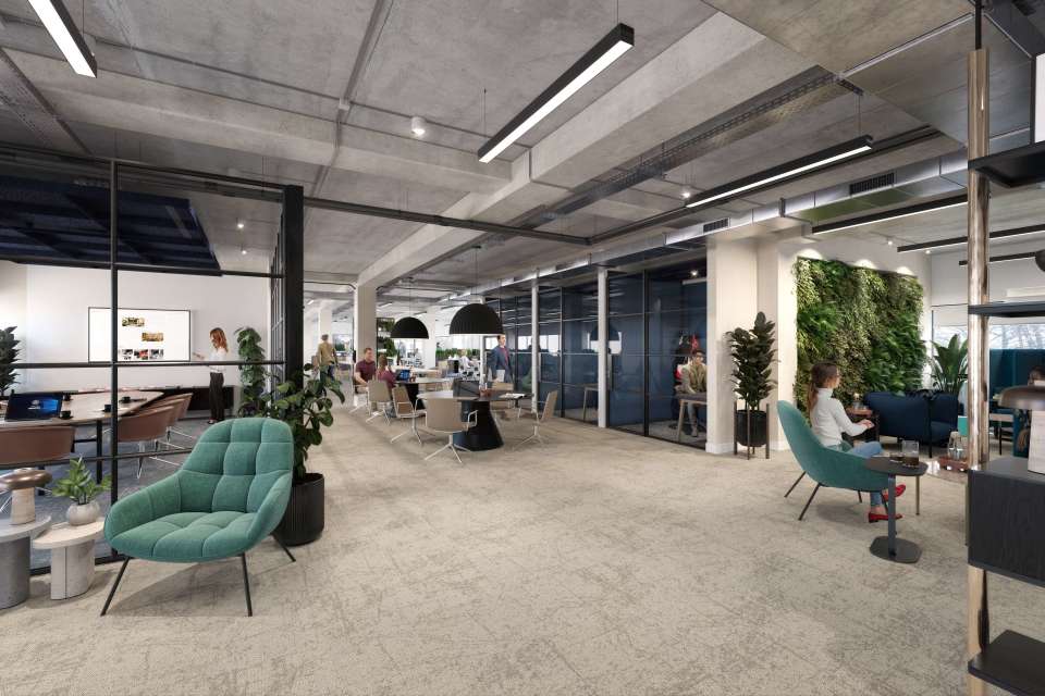 groundfloor office open plan with desks and breakout chairs 