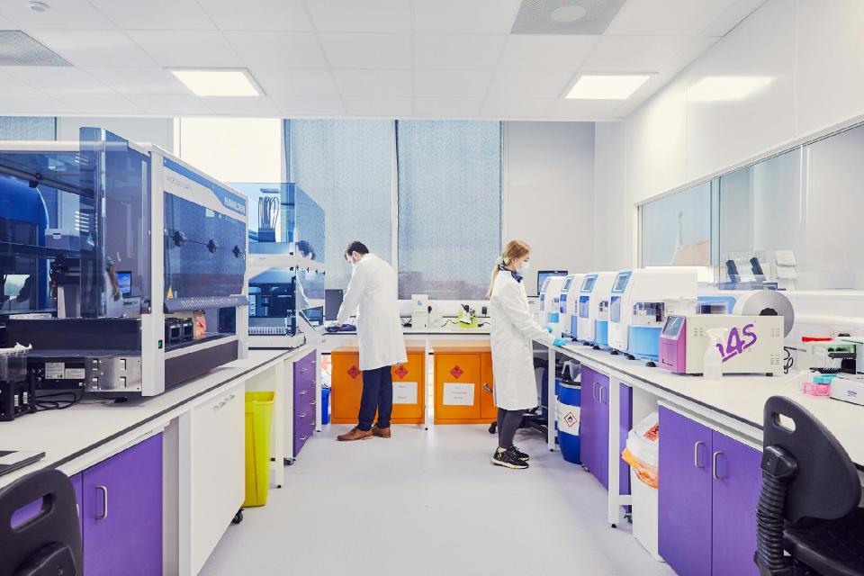 Lab space at the Citylabs campus showing 2 people working in a lab