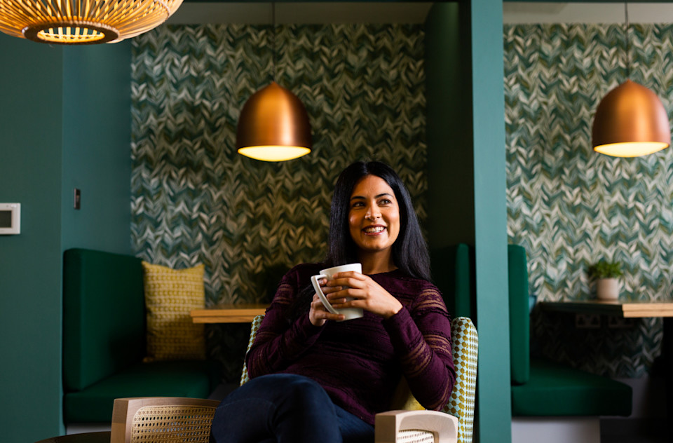 A woman drinking coffee