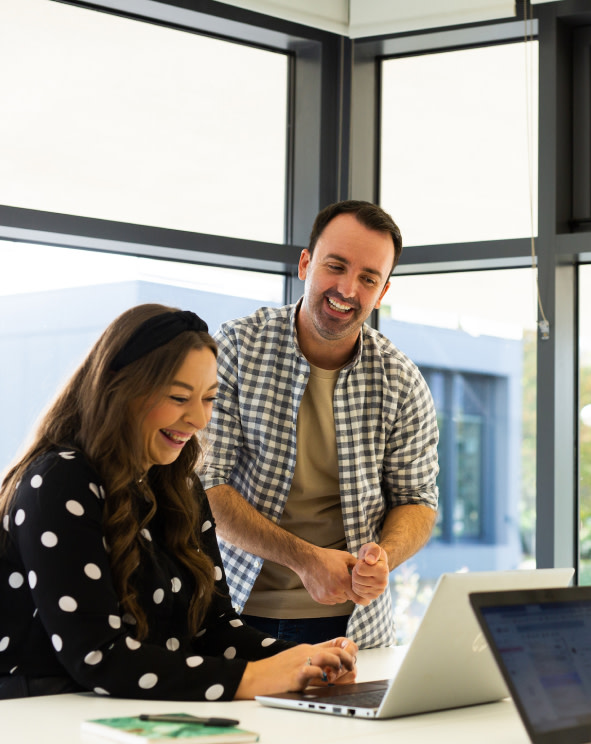 2 people looking at a computer screen